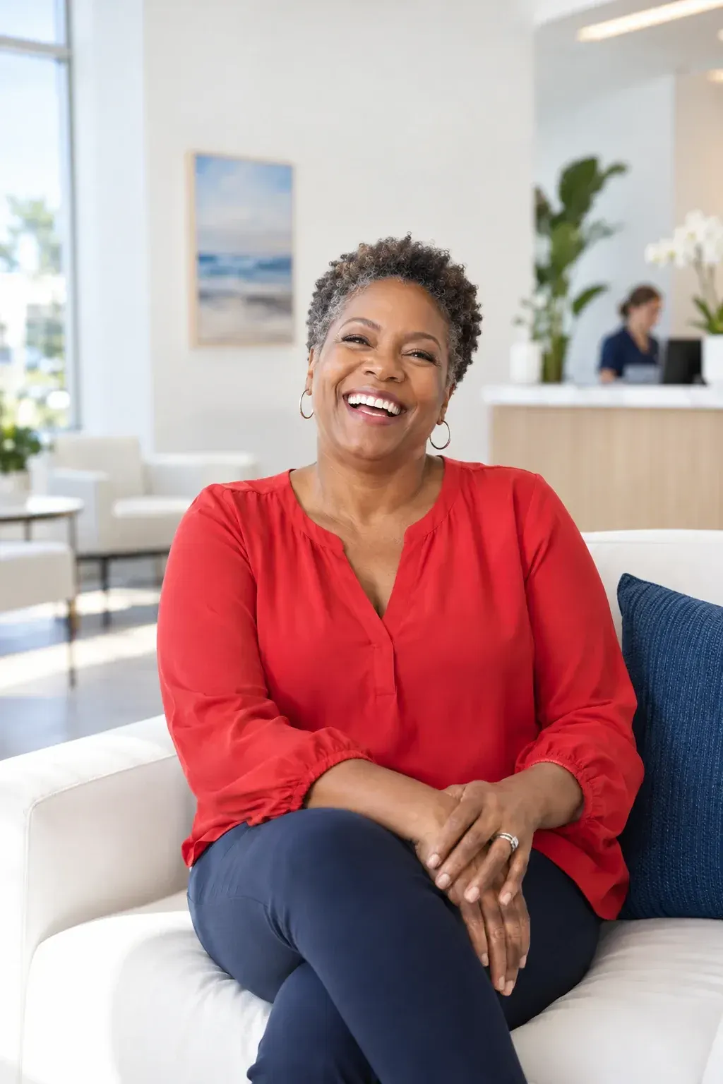 Confident woman in her forties smiling in natural light, a typical Emsella candidate at Ready Pain Management