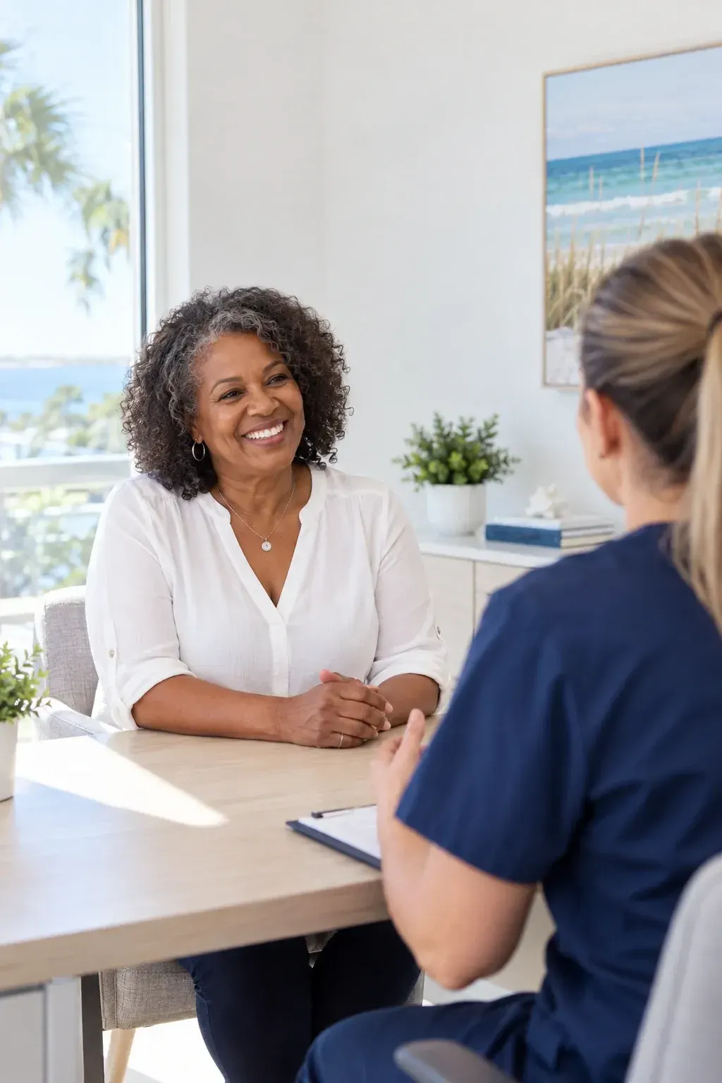 Physician and patient discussing hormone replacement therapy symptoms and goals at Ready Pain Management in Gulf Breeze, FL