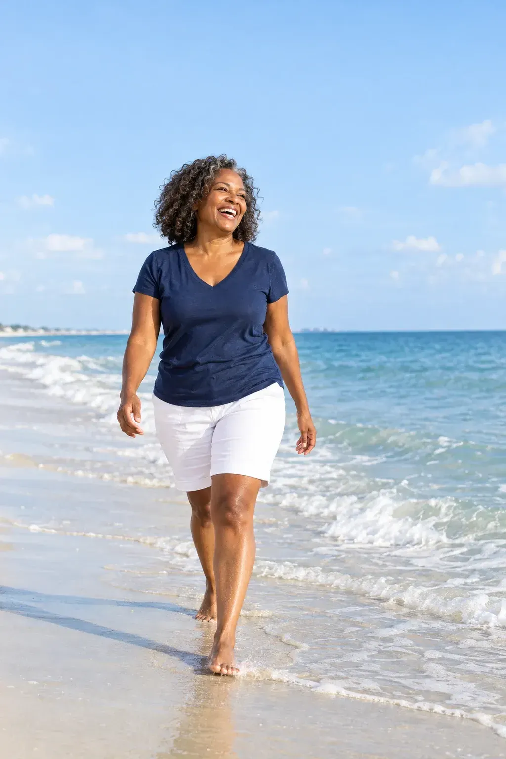 Adult sitting on a bed and touching numb tingling toes, a common early sign of neuropathy in feet seen in Gulf Breeze